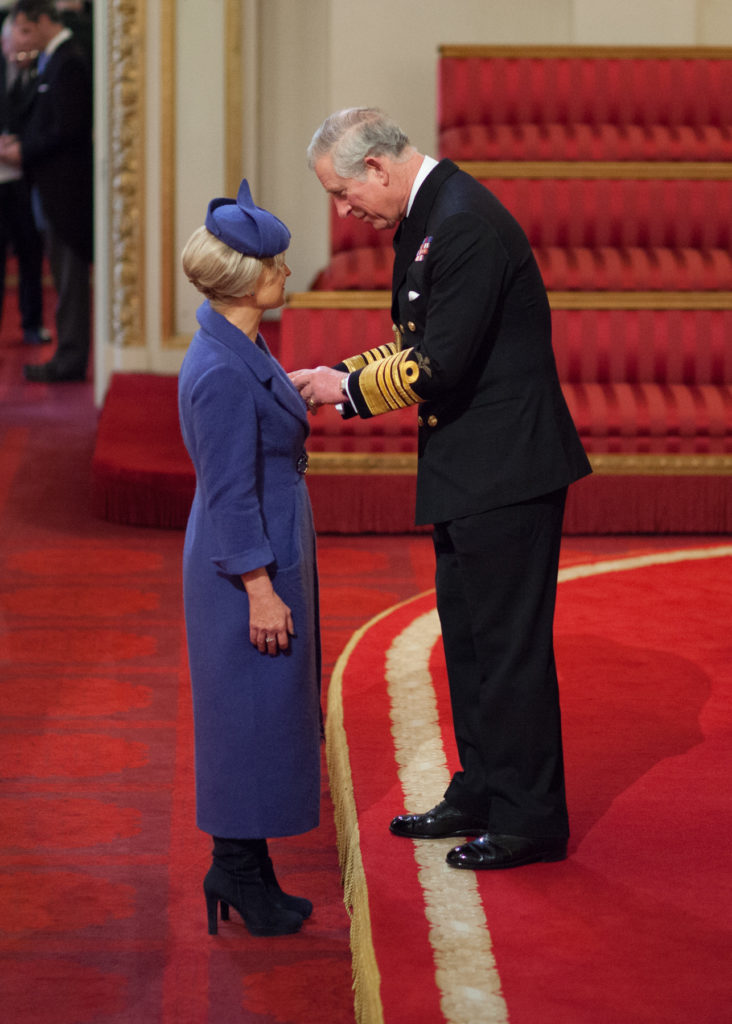 Joyce Young receiving OBE in Windsor Palace from King Charles III