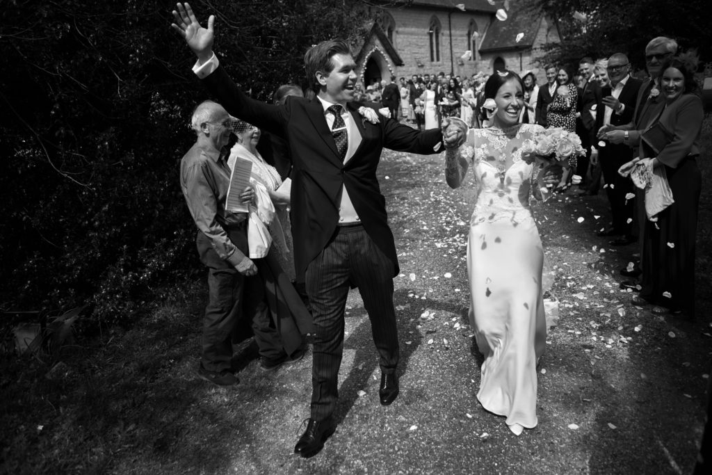 Proud groom greets the guests