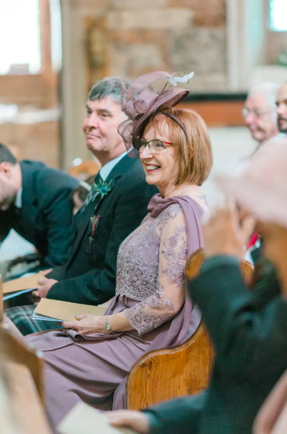 Mother of bride in her bespoke outfit at wedding