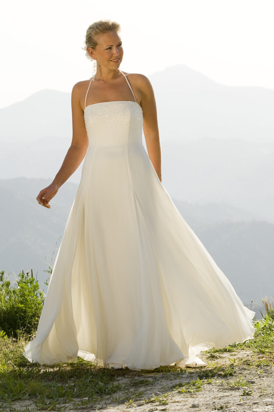 Destination wedding dress for bride. Square neck, spaghetti straps embellished bodice and straps, flare slit a-line skirt. Soft and feminine look. Light weight and perfect for casual beach wedding.