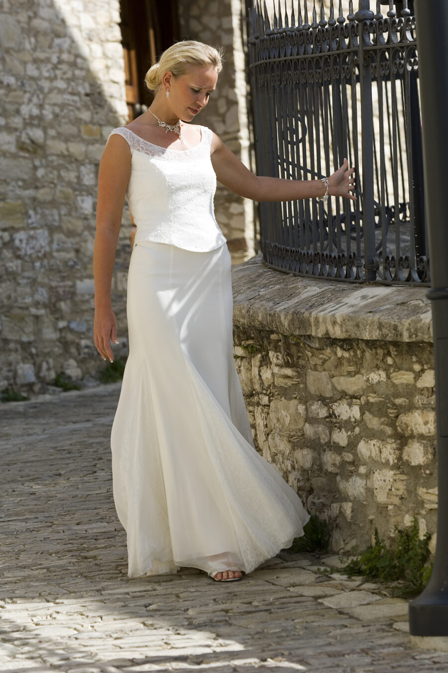 girl walking in 2 piece wedding outfit skirt and bodice