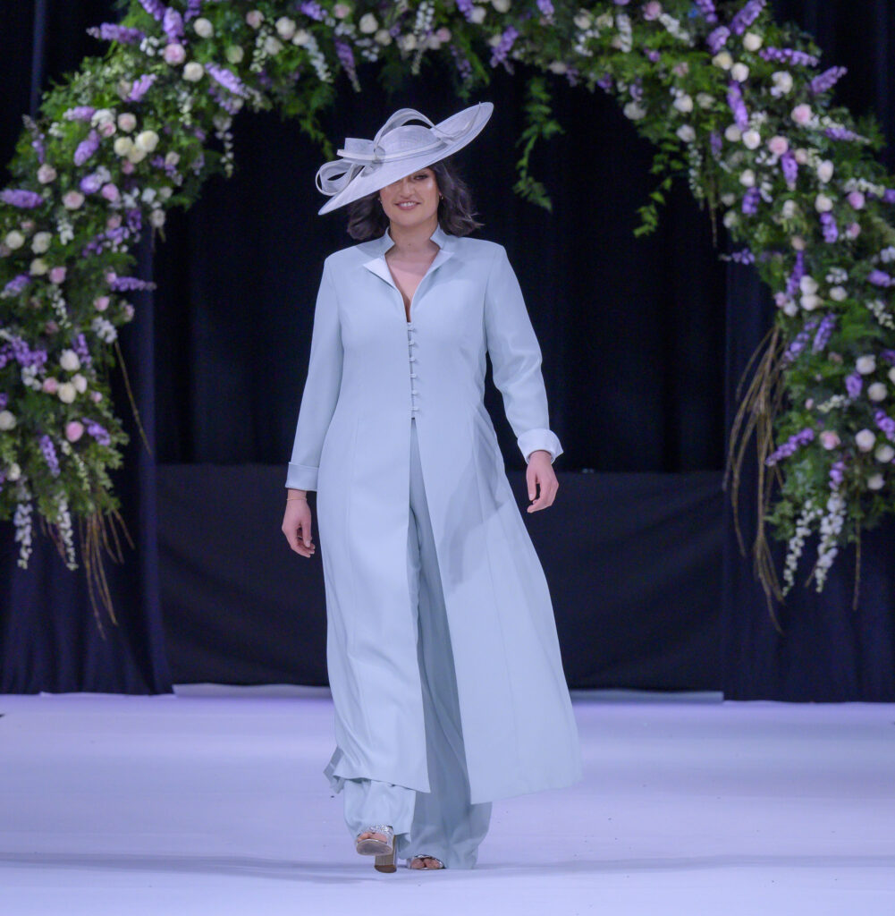 Model in trouser outfit on catwalk
