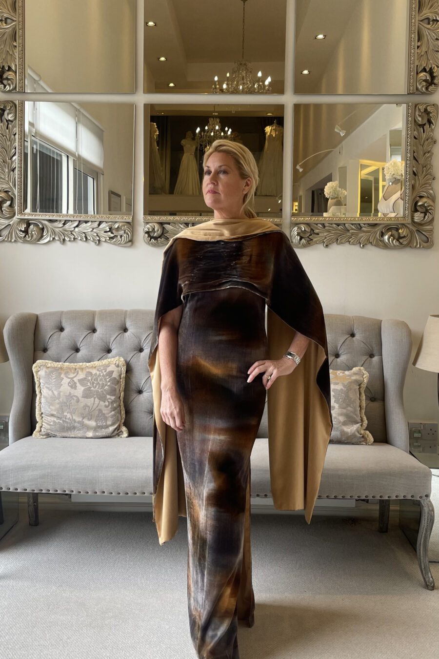 Model poses in velvet dress and stole